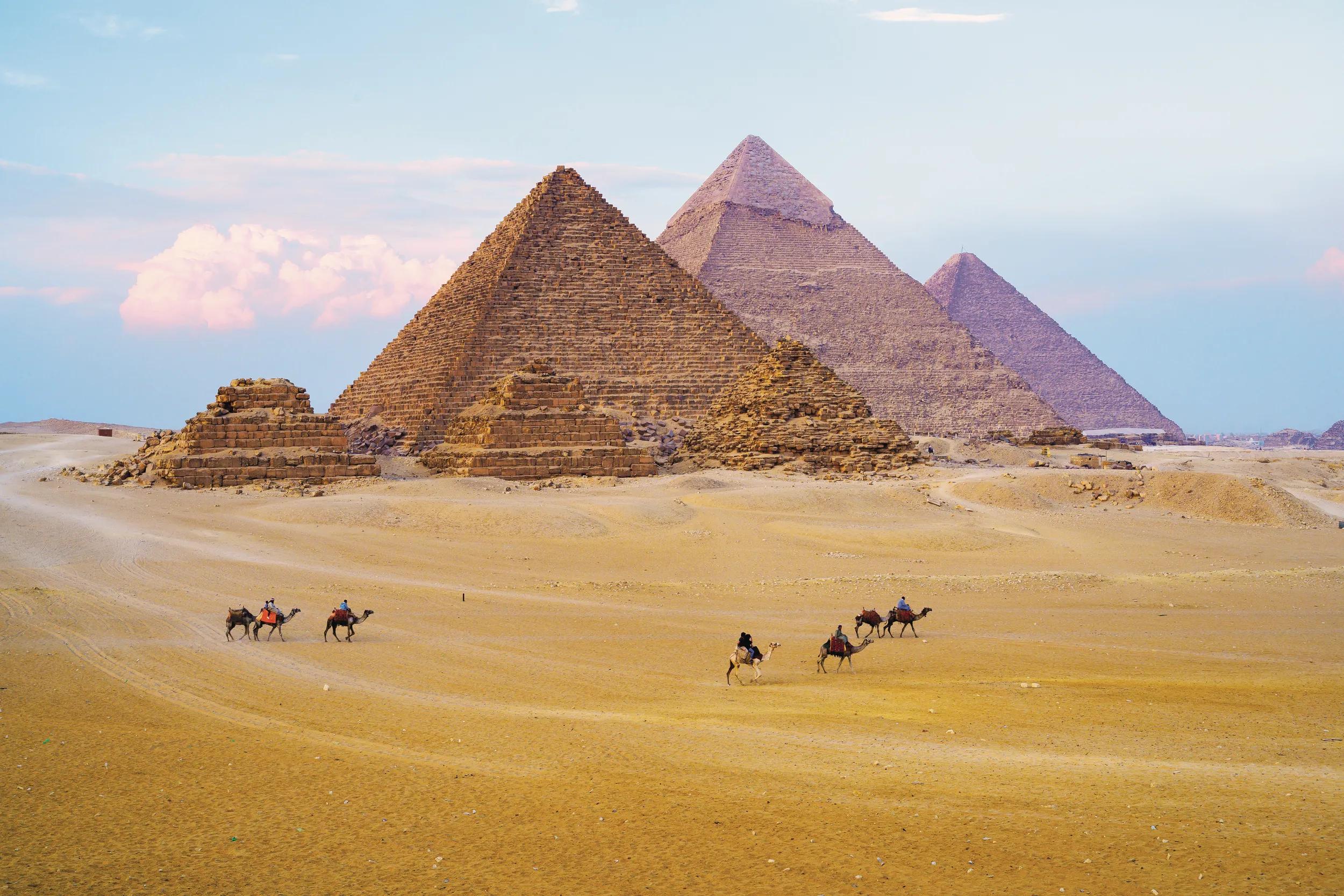 Giza Egypt Pyramids Camels Caravan Cairo Desert Wonders of the World.