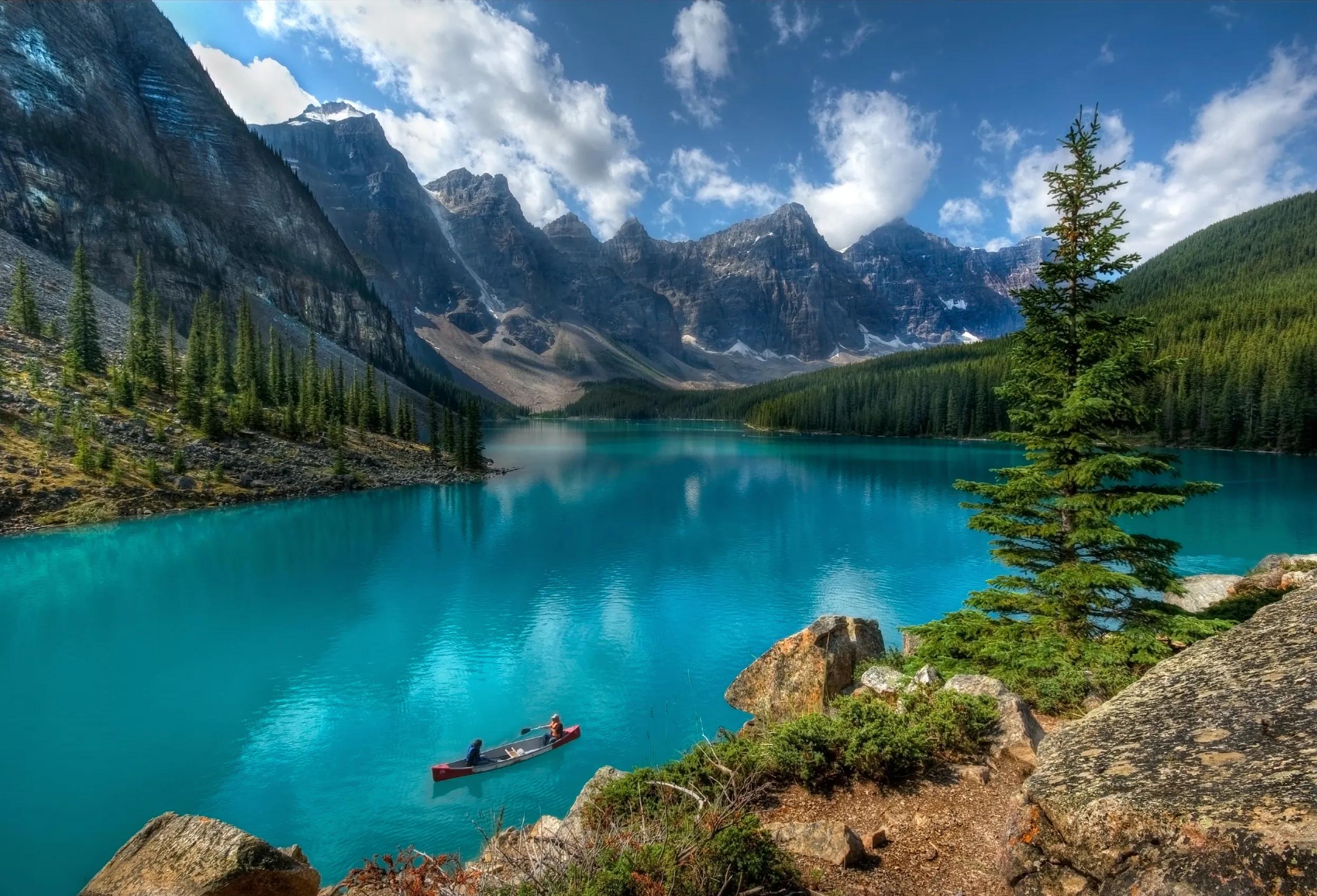"Boaters on Moraine Lake, Banff National Park, Alberta, Canada."