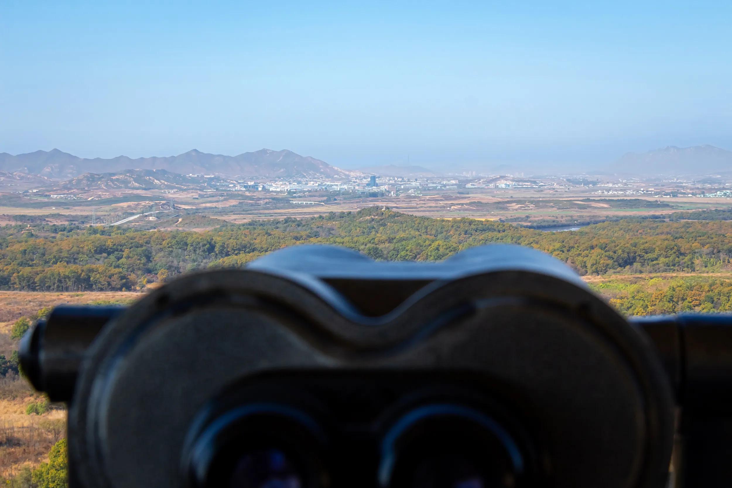 A view into North Korea across the DMZ from South Korea, from behind binoculars at the Dorsa Observatory in Paju