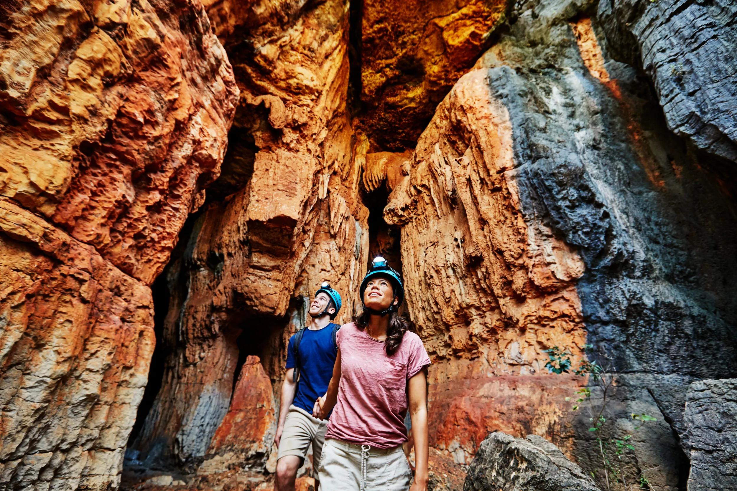 Couple exploring the Mimbi Caves with Girloorloo Tours. The Mimbi Caves are located 90 km's east of Fitzroy Crossing.