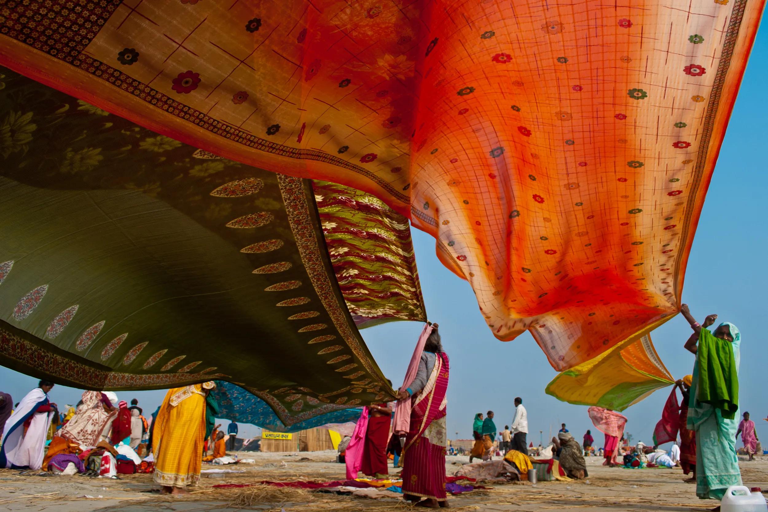 Pilgrims drying their cloths at Gangasagar Mela, the largest fair celebrated in West Bengal, India.