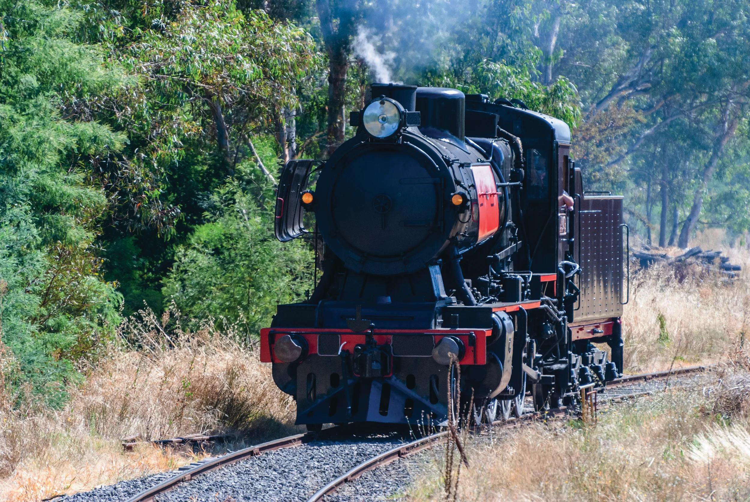 Historic steam train running on Maldon – Castlemaine route in the goldfields of Victoria, Australia.
