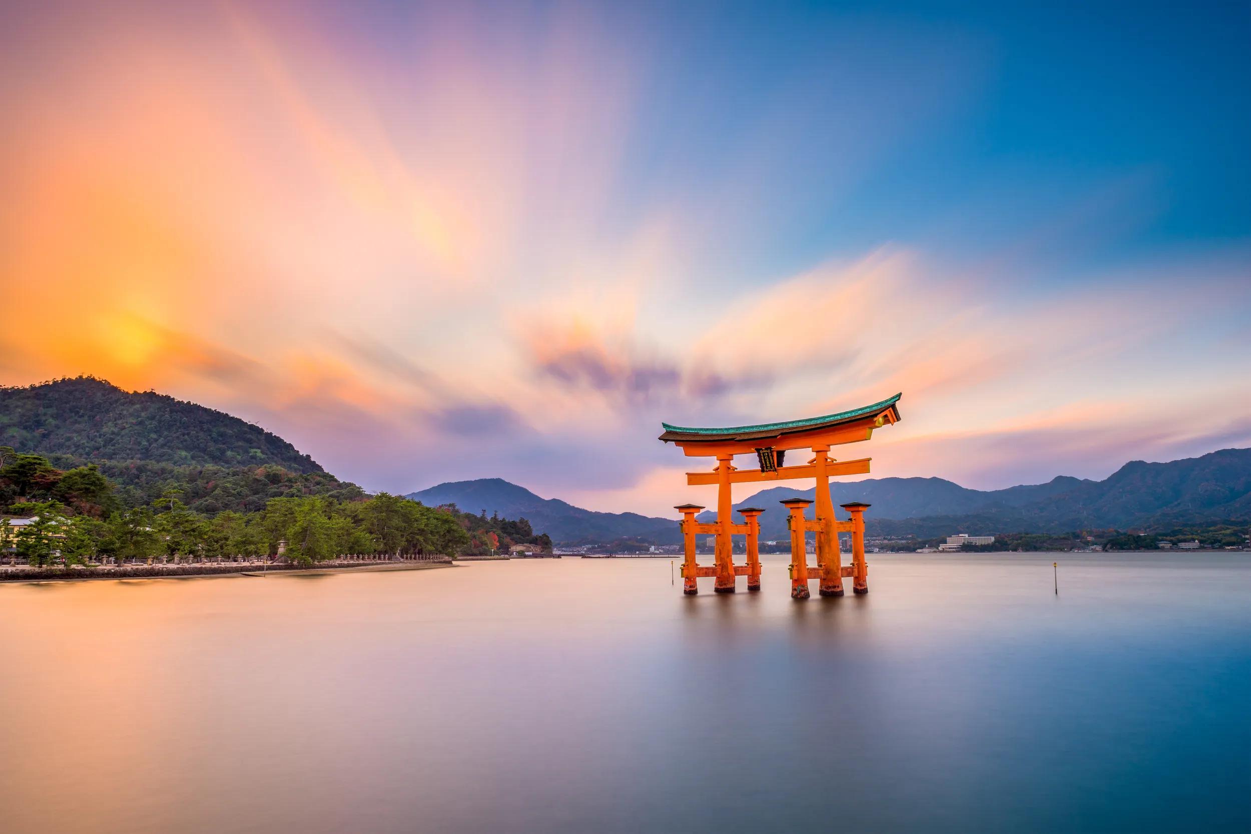Miyajima, Hiroshima, Japan at the floating gate of Itsukushima Shrine. (gate sign reads Itsukushima Shrine)