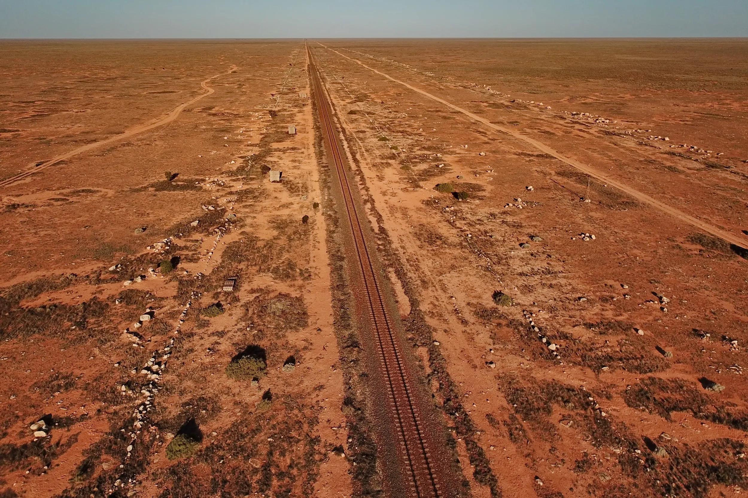 Indian-Pacific rail line across the flat desert  Nullarbor Plain.
