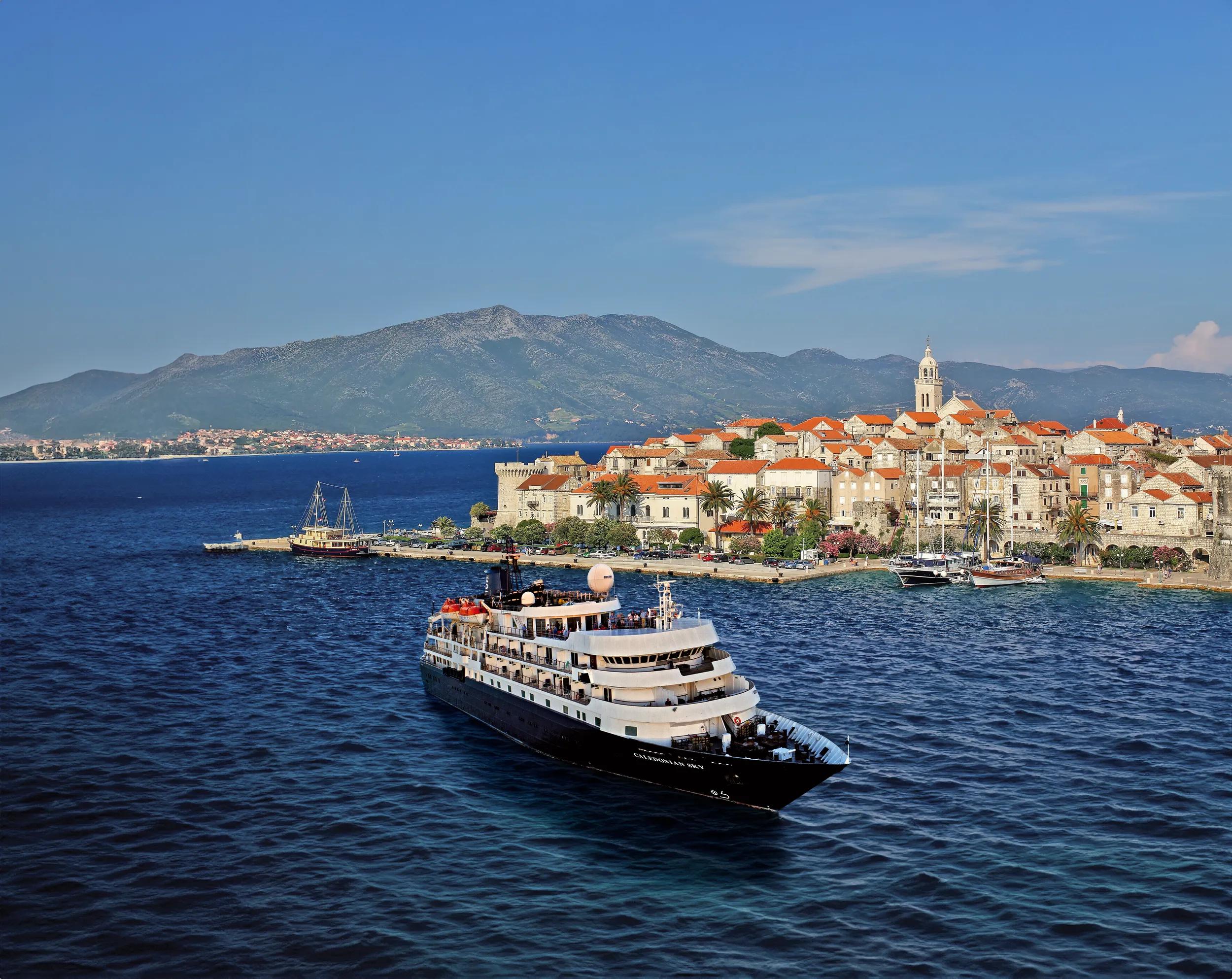 The ship Caledonian Sky near Korcula old town, Croatia. Manipulated image.