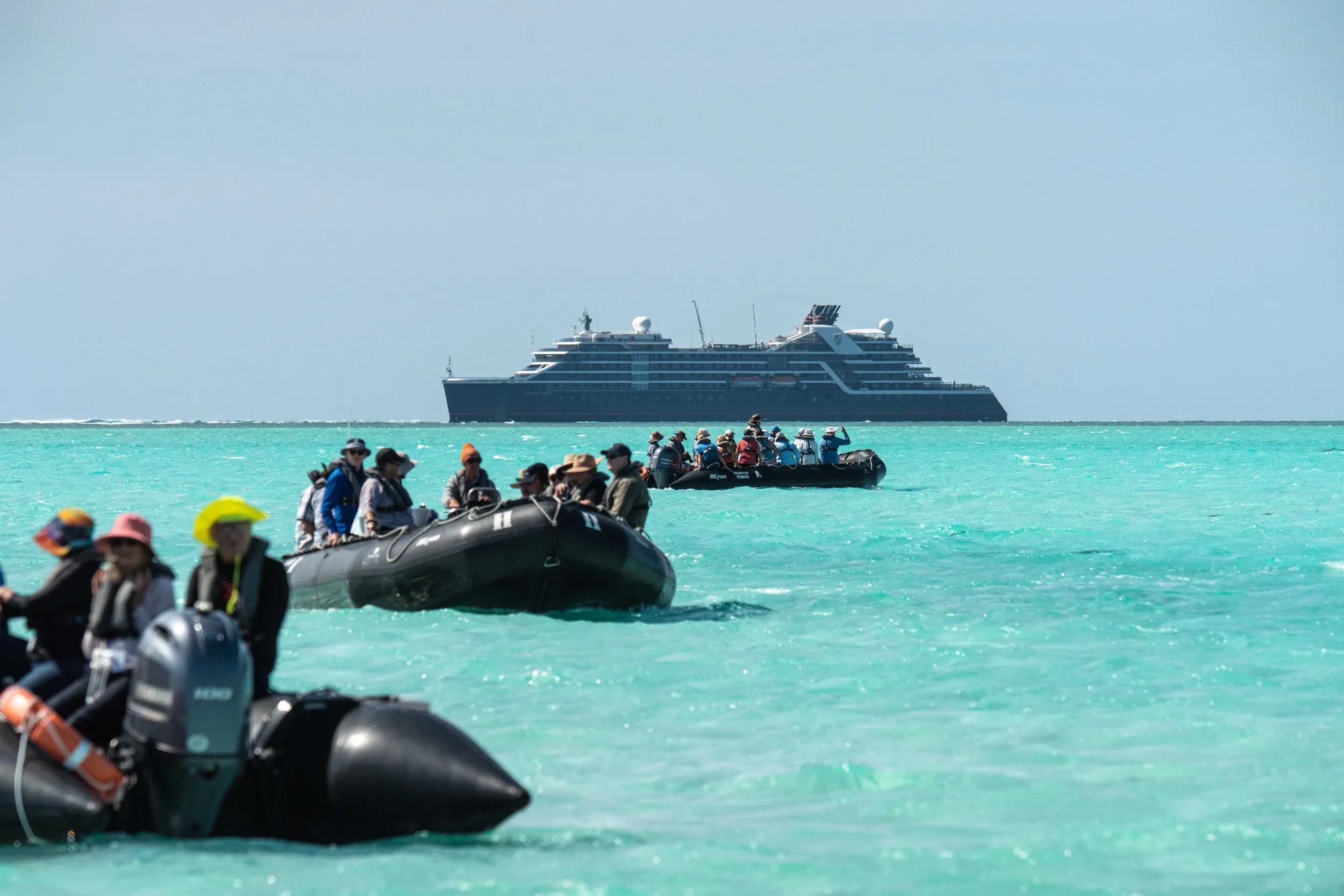 Zodiacs, people, ship at Ashmore Reef, Seabourn Pursuit Kimberley Voyage June 2025
