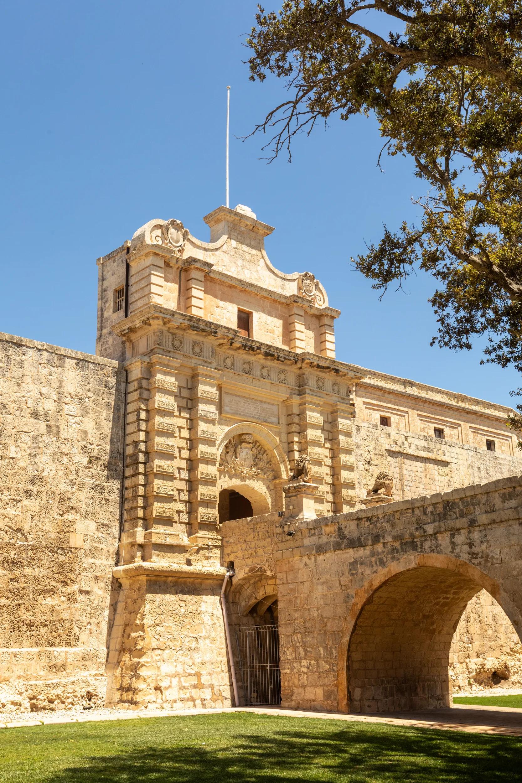 Entrance stone bridge and gate to fortified medieval city Mdina called silent city in the Northern Region of Malta.