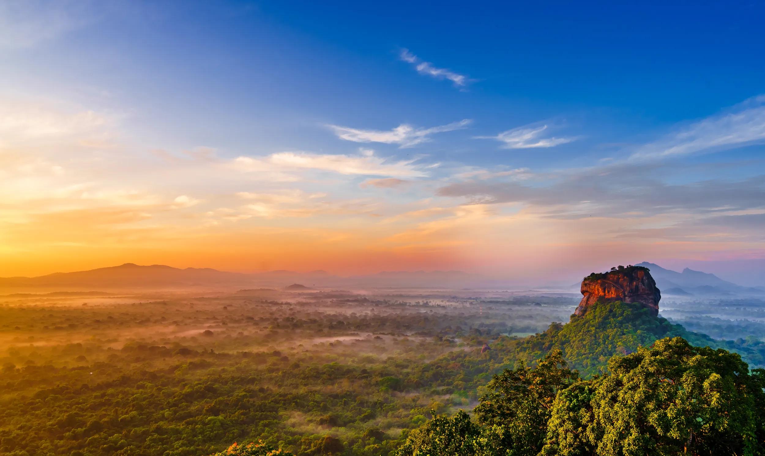 Sunrise view to Sigiriya rock - Lion Rock - from Pidurangala Rock in Sri Lanka.