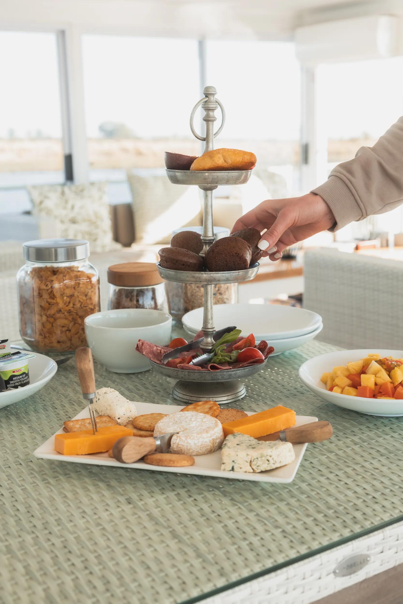 Chobe Princess Houseboat - Dining in the lounge with cheese and biscuits.