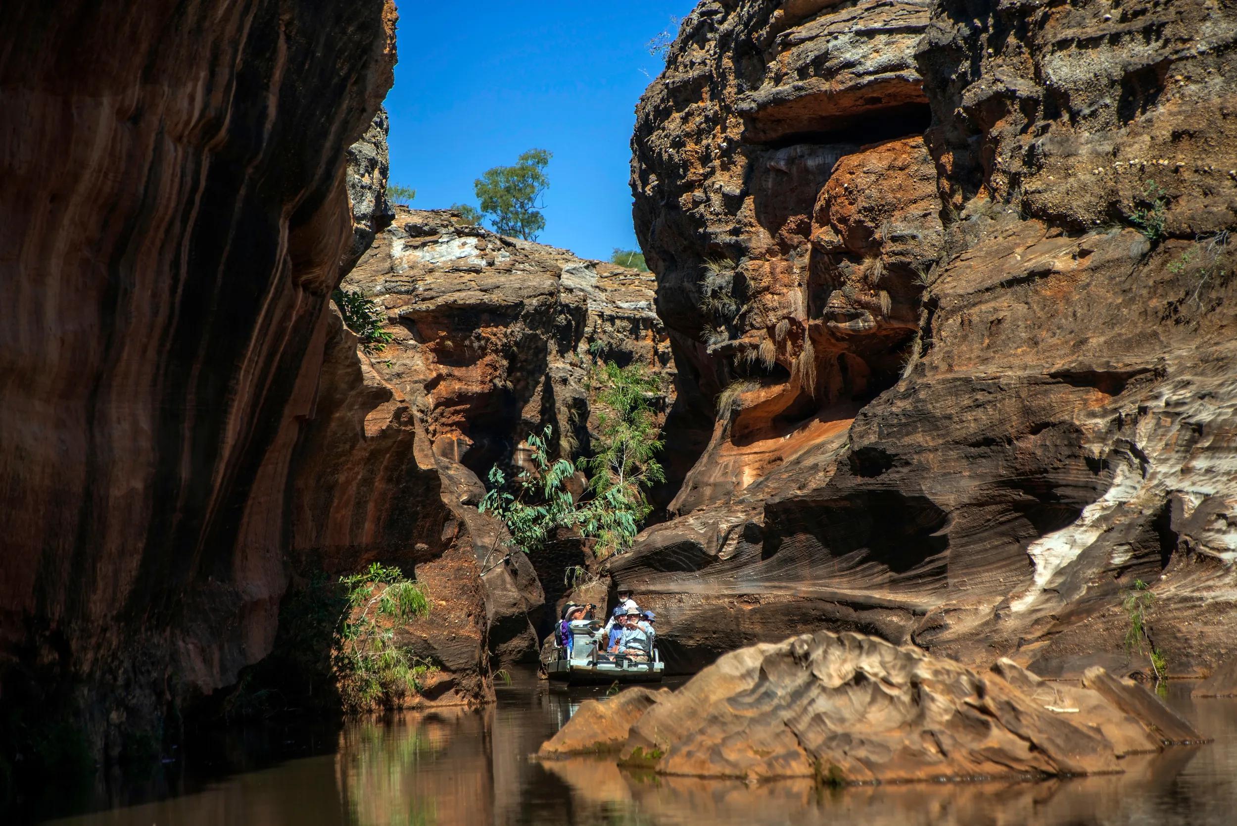 COBBOLD GORGE, QUEENSLAND / AUSTRALIA - CIRCA 2014: Boat trip through remote Cobbold Gorge in Outback Queensland. The narrow gorge can only be visited by private guided tour through the station owners