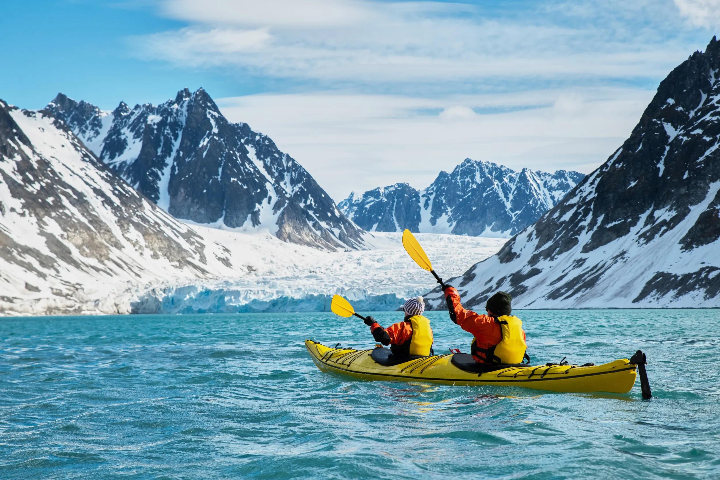Guests kayaking at Magdalenefjorden, Svalbard