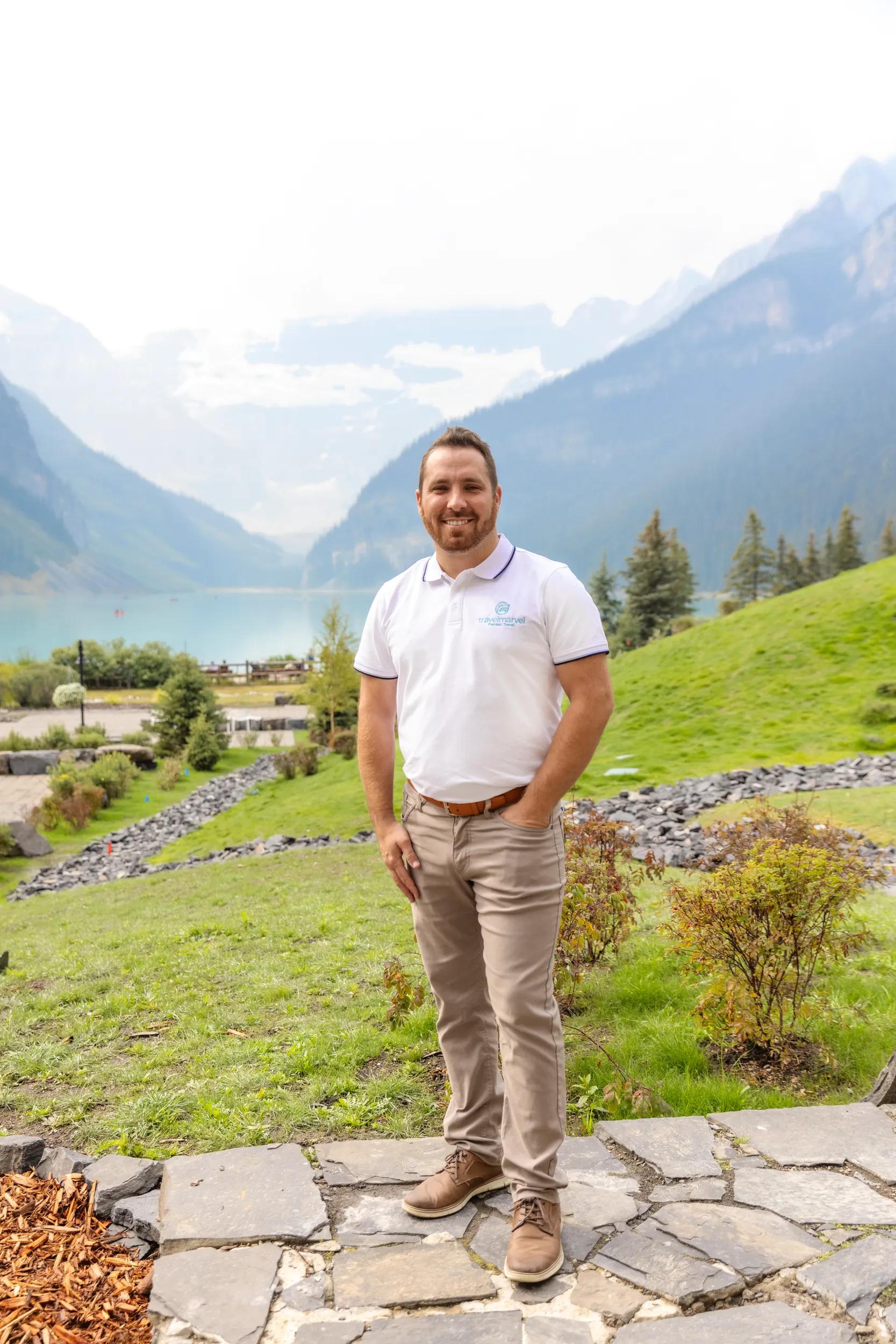 Tour Director Zac Watts in Travelmarvel uniform, Lake Louise, Canada.