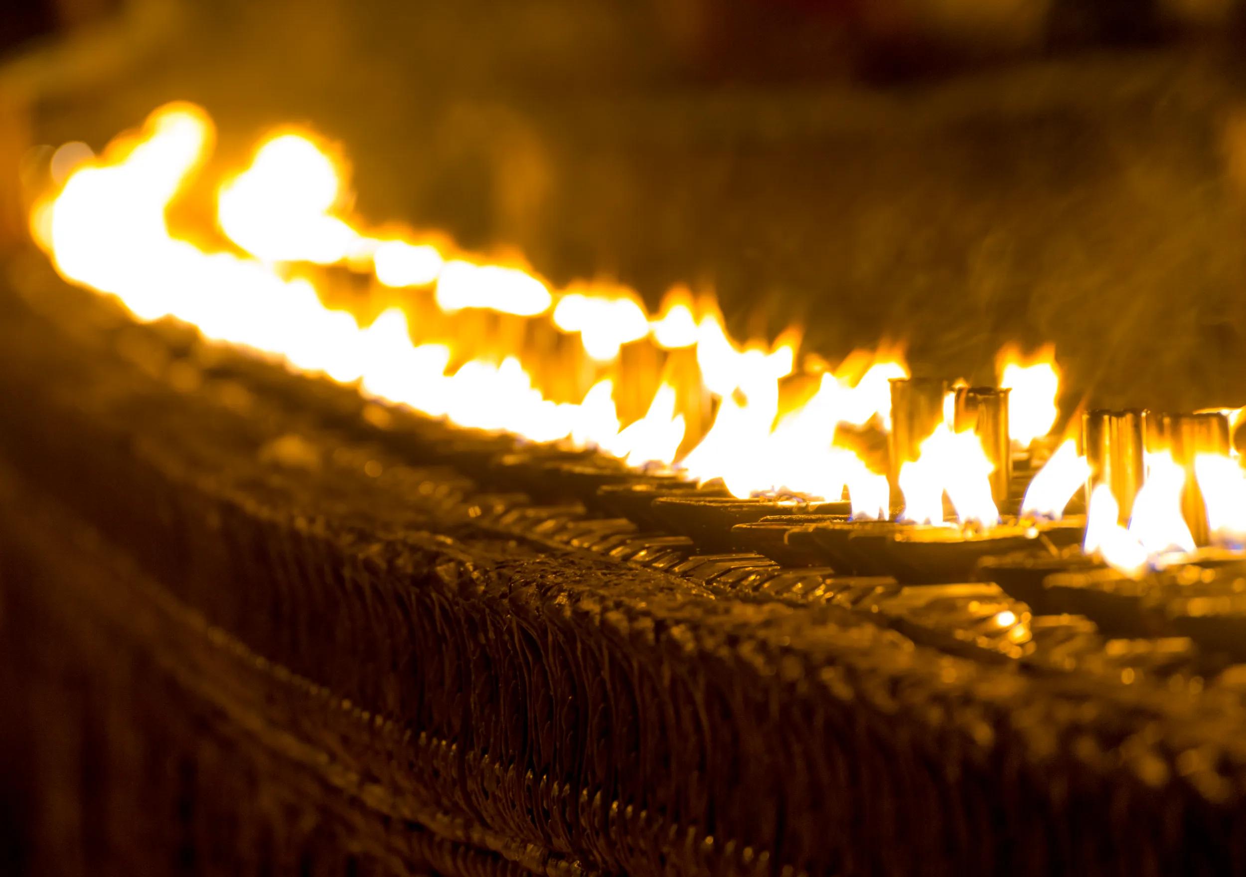 The row of lighten holy candles from the prayers at Shwedagon Pagoda, Yangon, Myanmar.