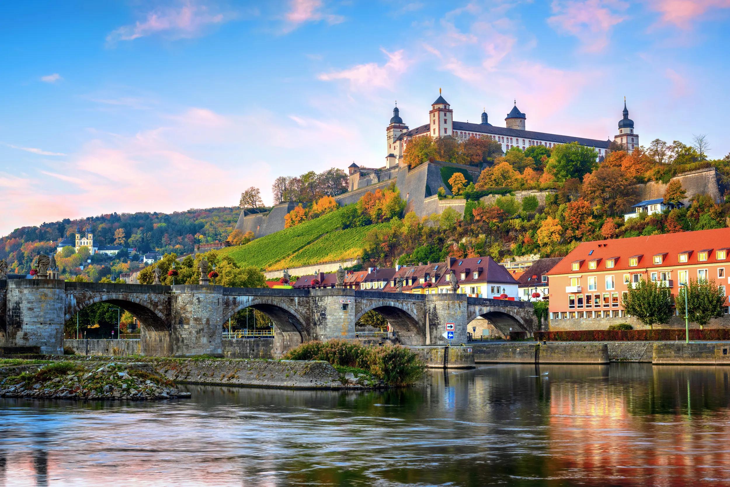 Wurzburg, Bavaria, Germany, view of the Marienberg Fortress and the Old Main Bridge on colorful sunrise