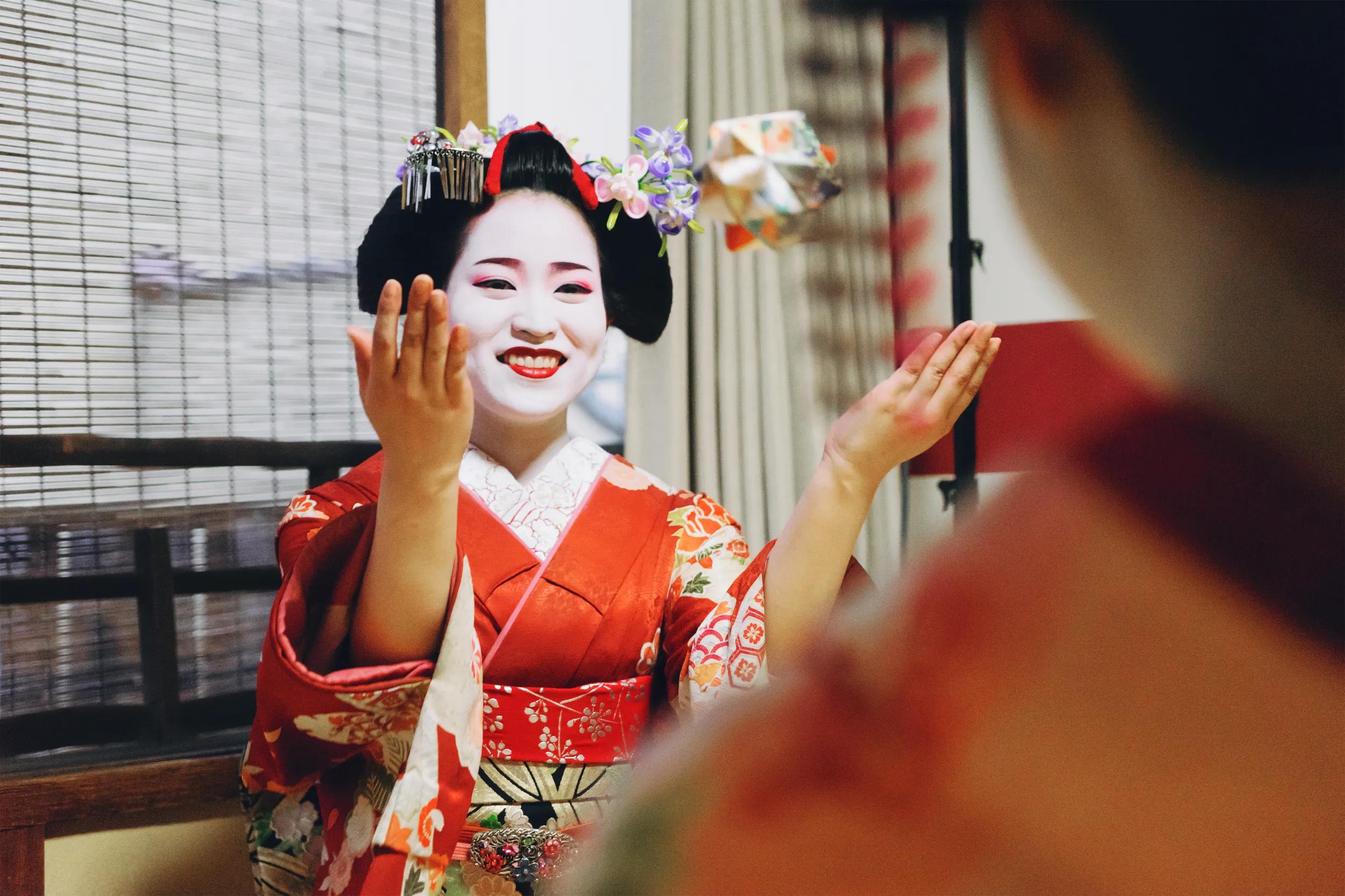 Maiko Girls Playing With Origami Paper
