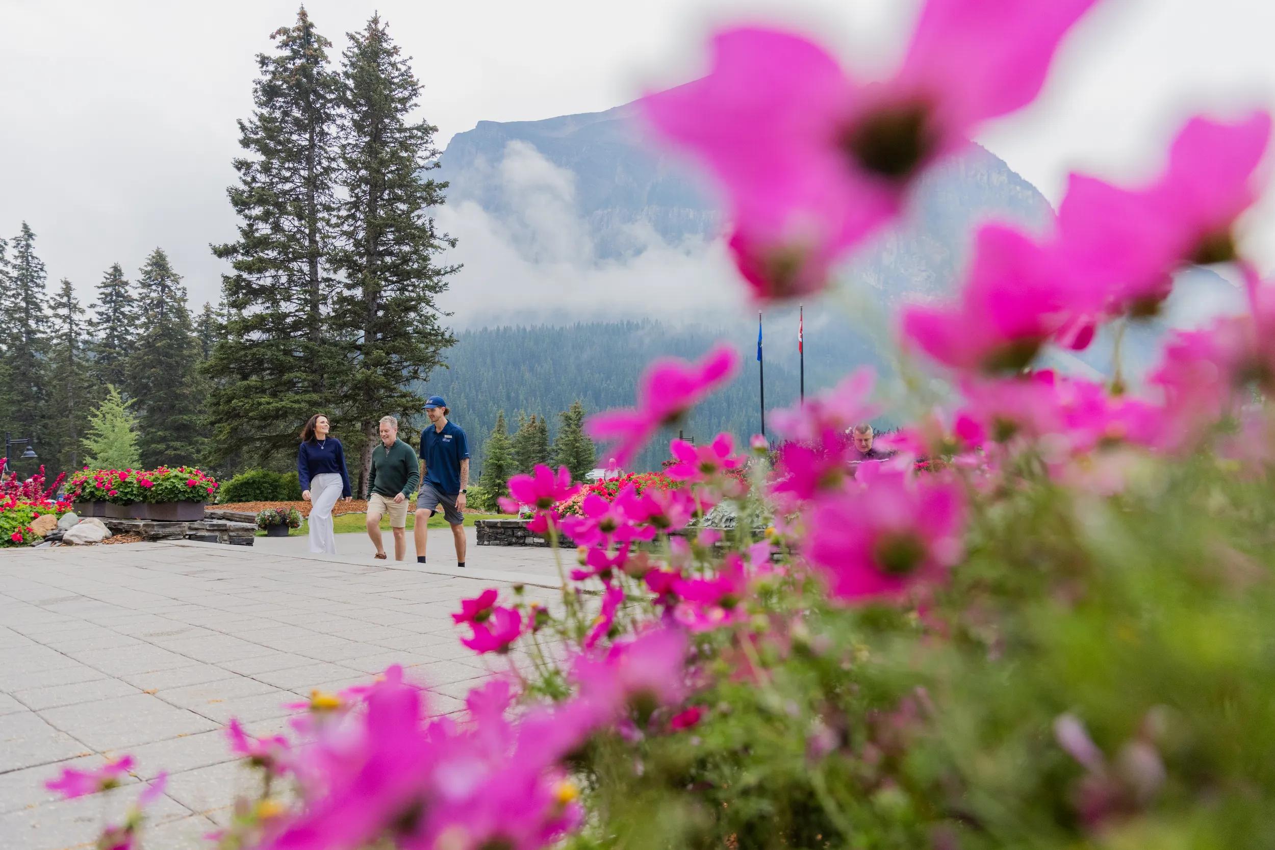 Hiking Guide Sam with guest couple at Fairmont Chateau Lake Louise, Banff, Canada.
