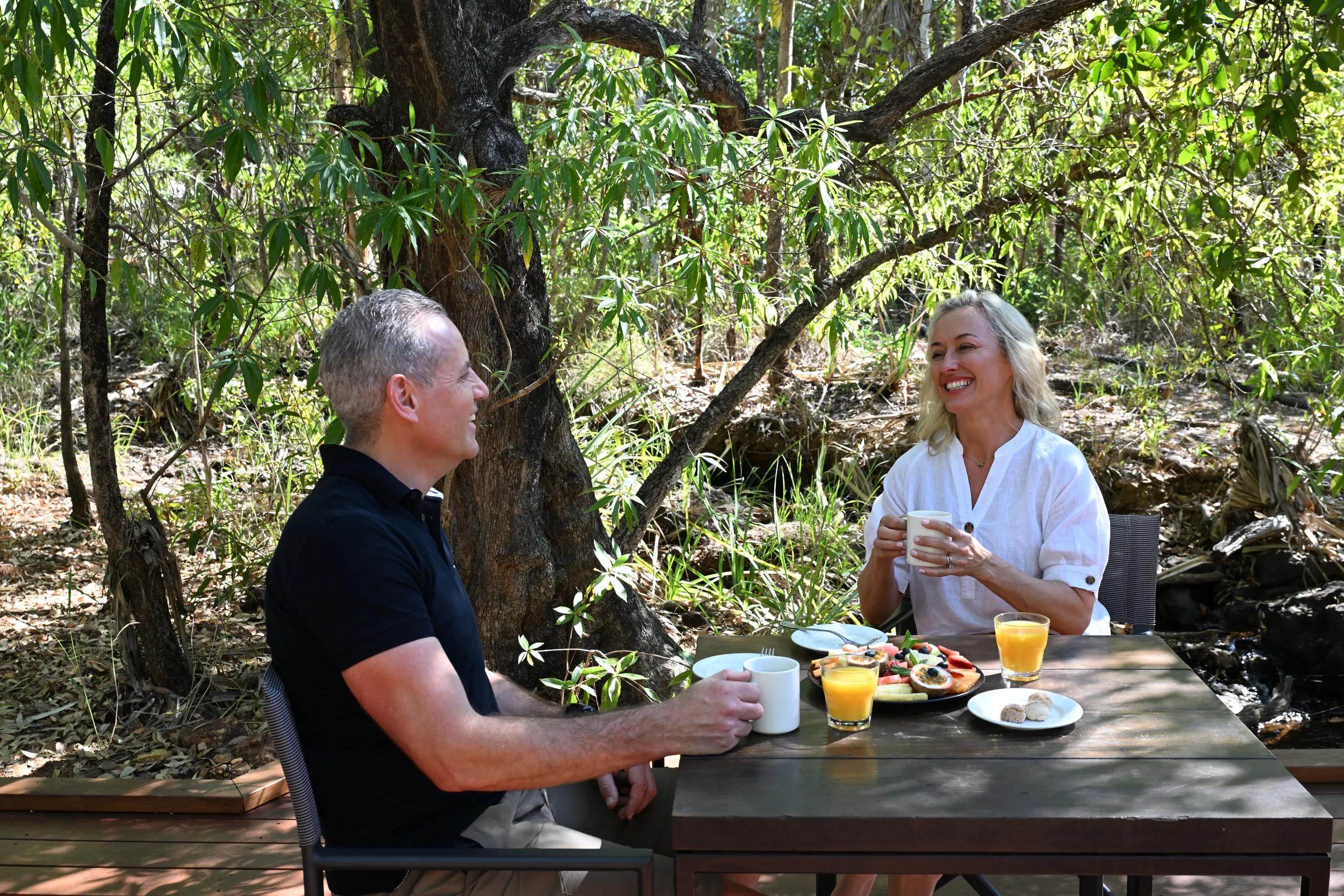 Couple eating by Lodge swimming hole - APT - Mitchell Falls photo shoot 2024.