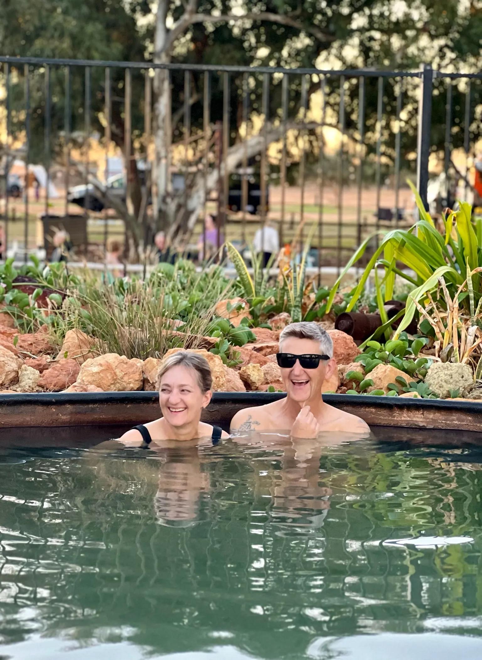Couple relax in Artesian Bath, Wooramel River Retreat, Carnarvon, WA.