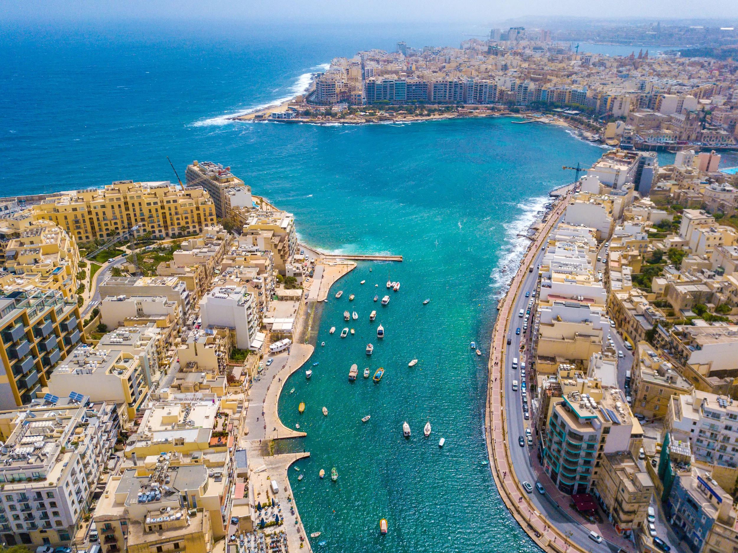Overhead aerial view of boat harbour and city of Sliema, Malta.