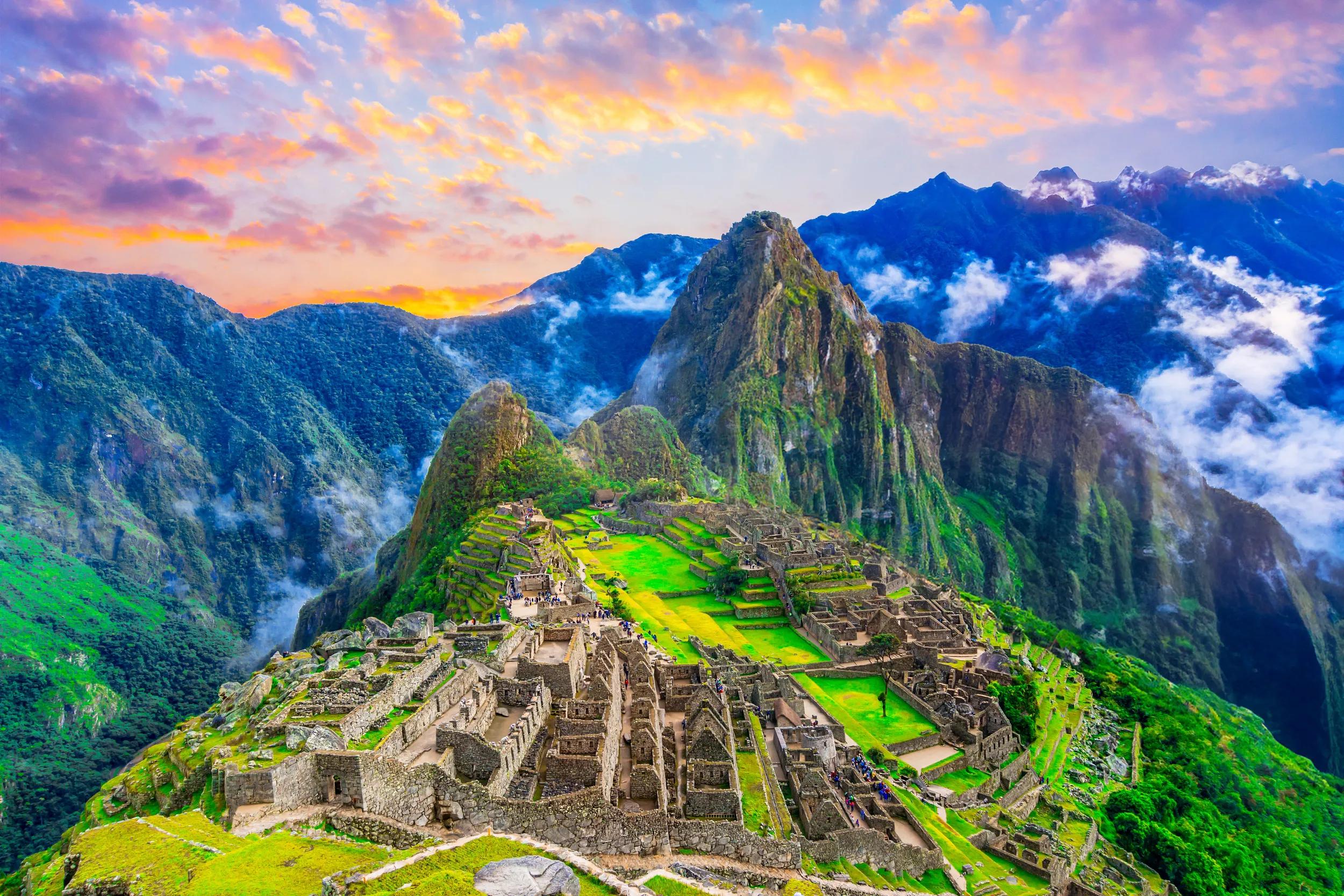 Machu Picchu, Peru: Overview of the lost inca city Machu Picchu, agriculture terraces and Wayna Picchu, peak in the background,before sunrise