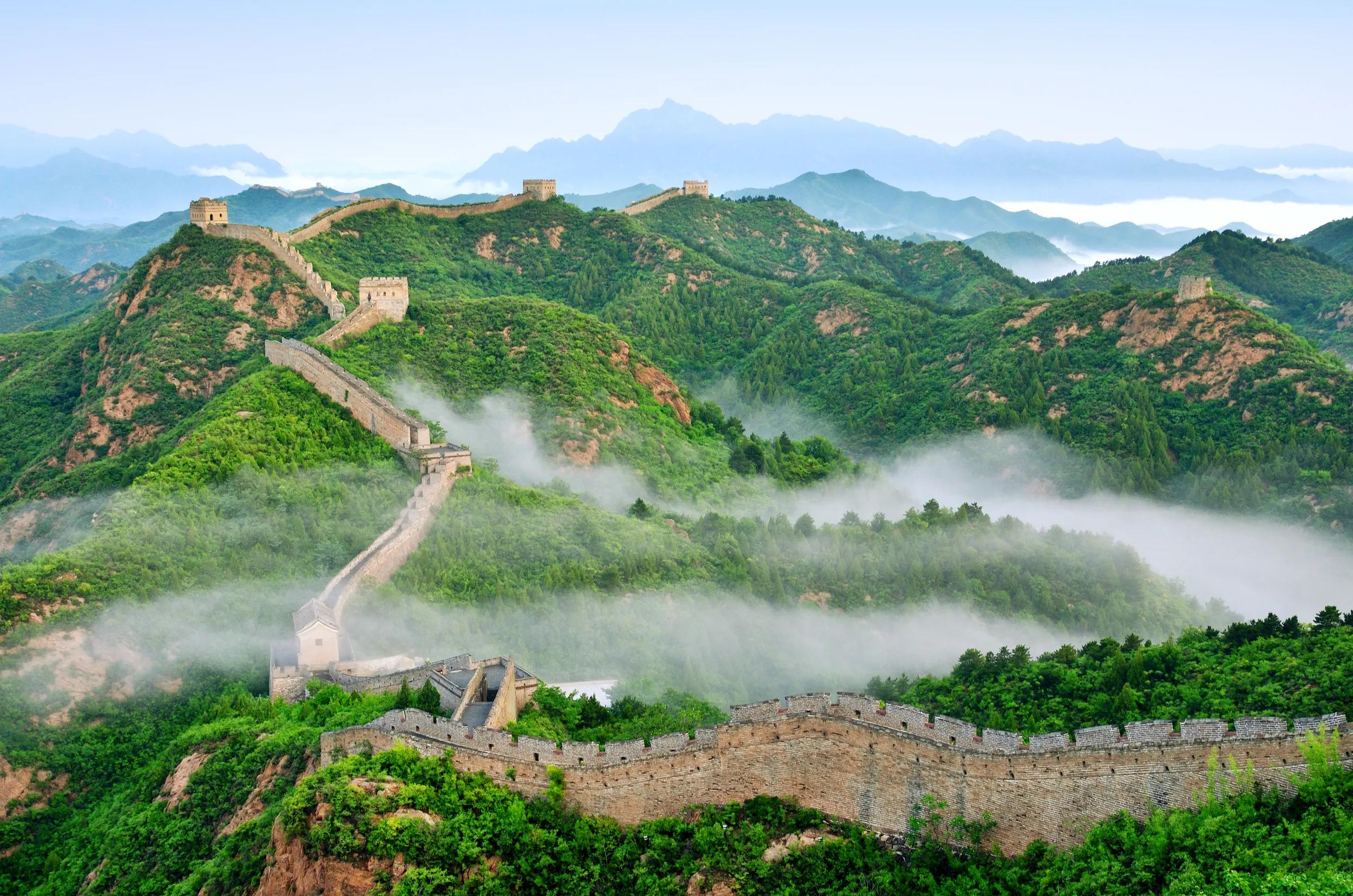 Aerial view of the Great Wall of China in morning fog.