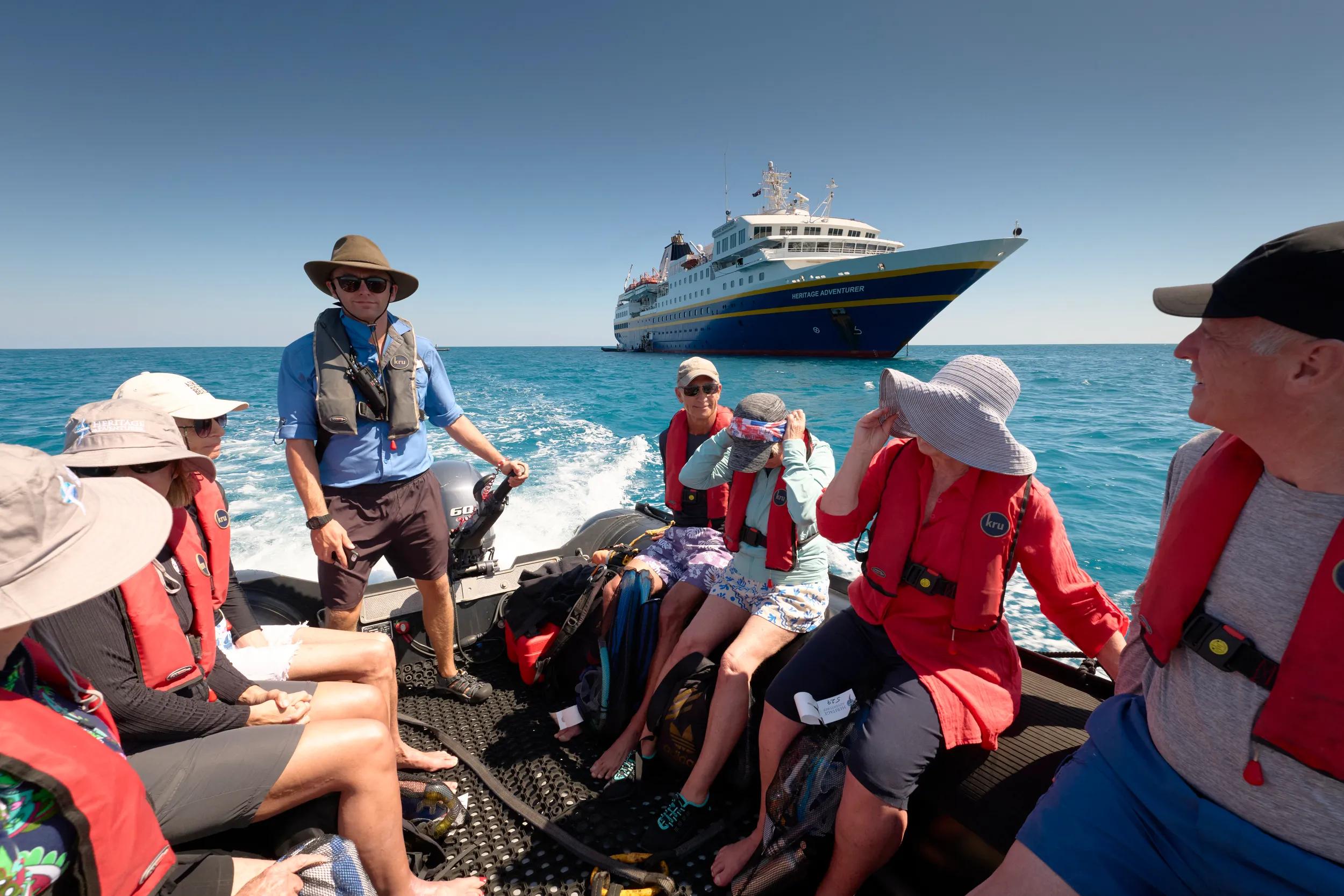 Passengers from the Heritage Adventurer motoring in a zodiac at Ashmore Reef