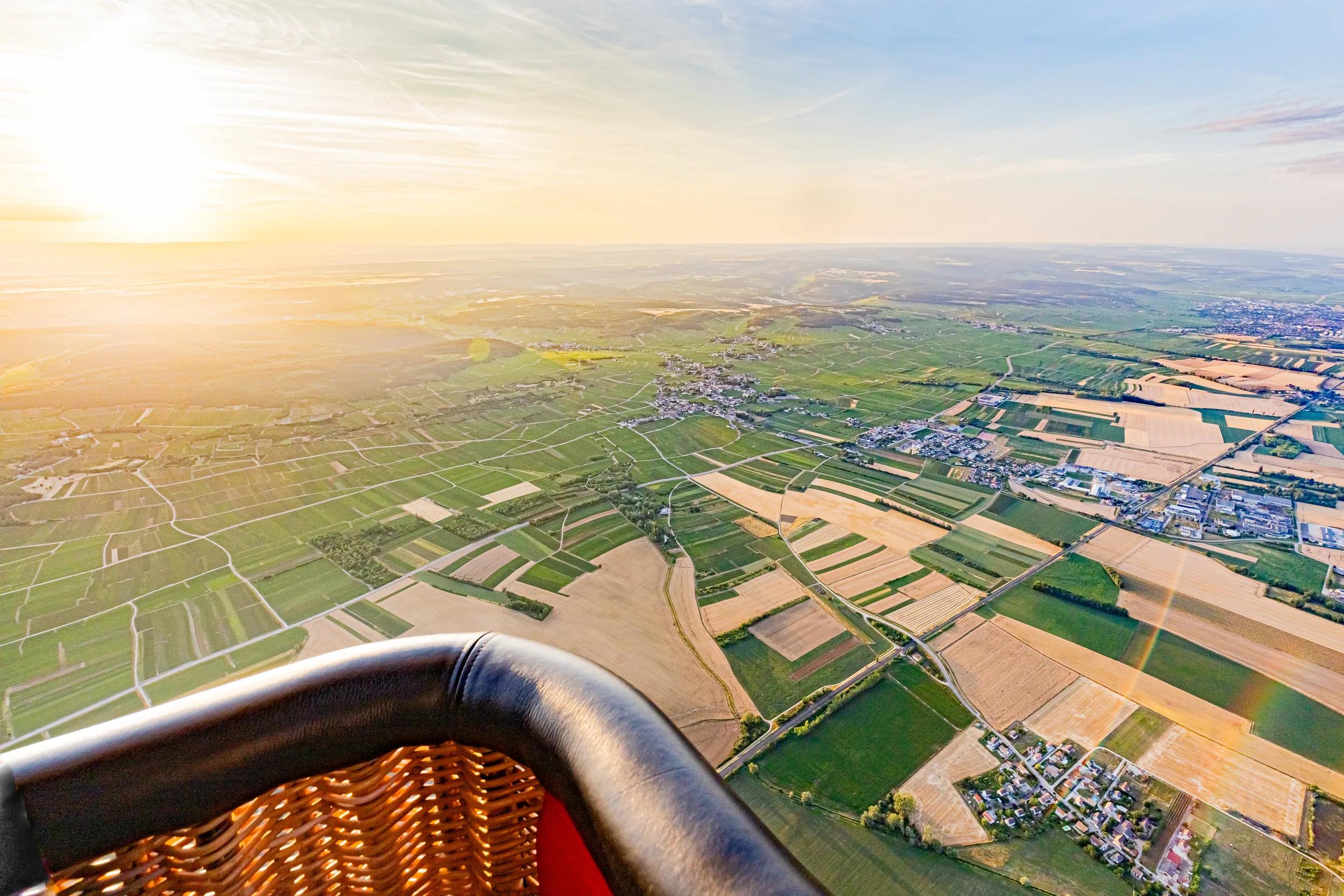 Hot-air balloon basket and view of the fields over Pommard, France.