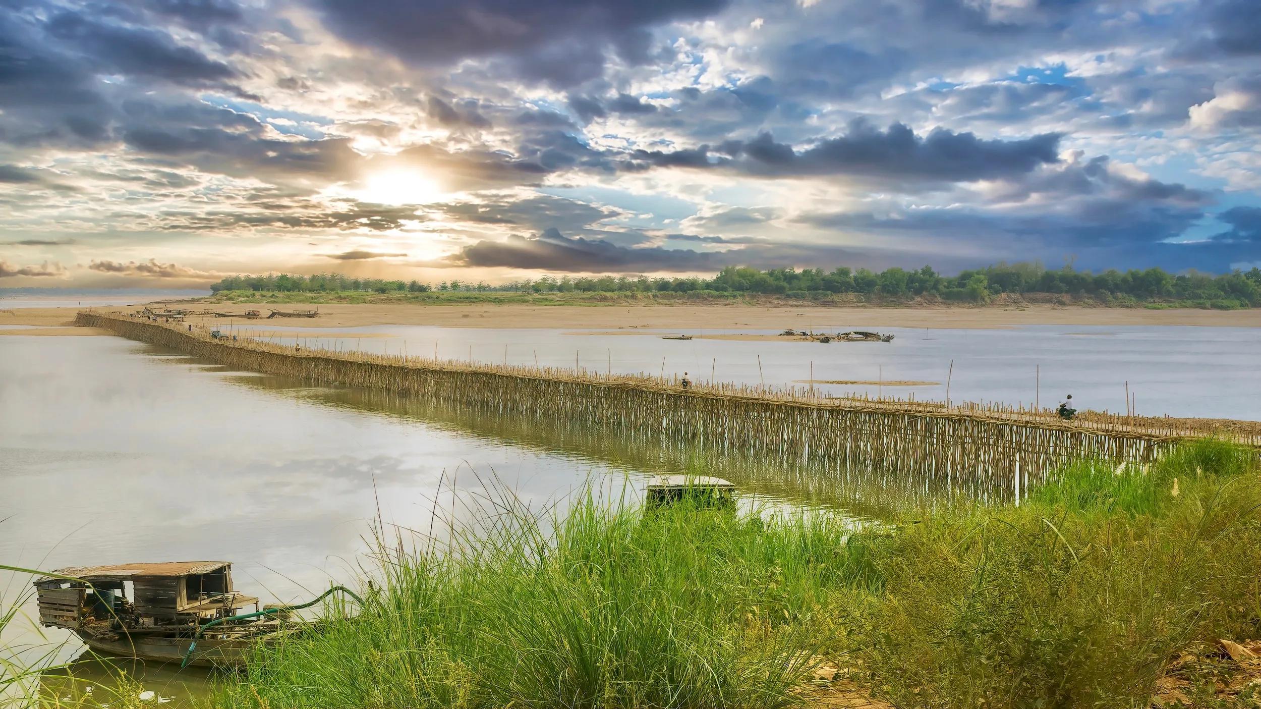 The iconic handmade bamboo bridge in eastern Cambodia which is built each year during the dry season, to cross the Mekong River, connecting the town of Kampong Cham to Koh Paen island.
