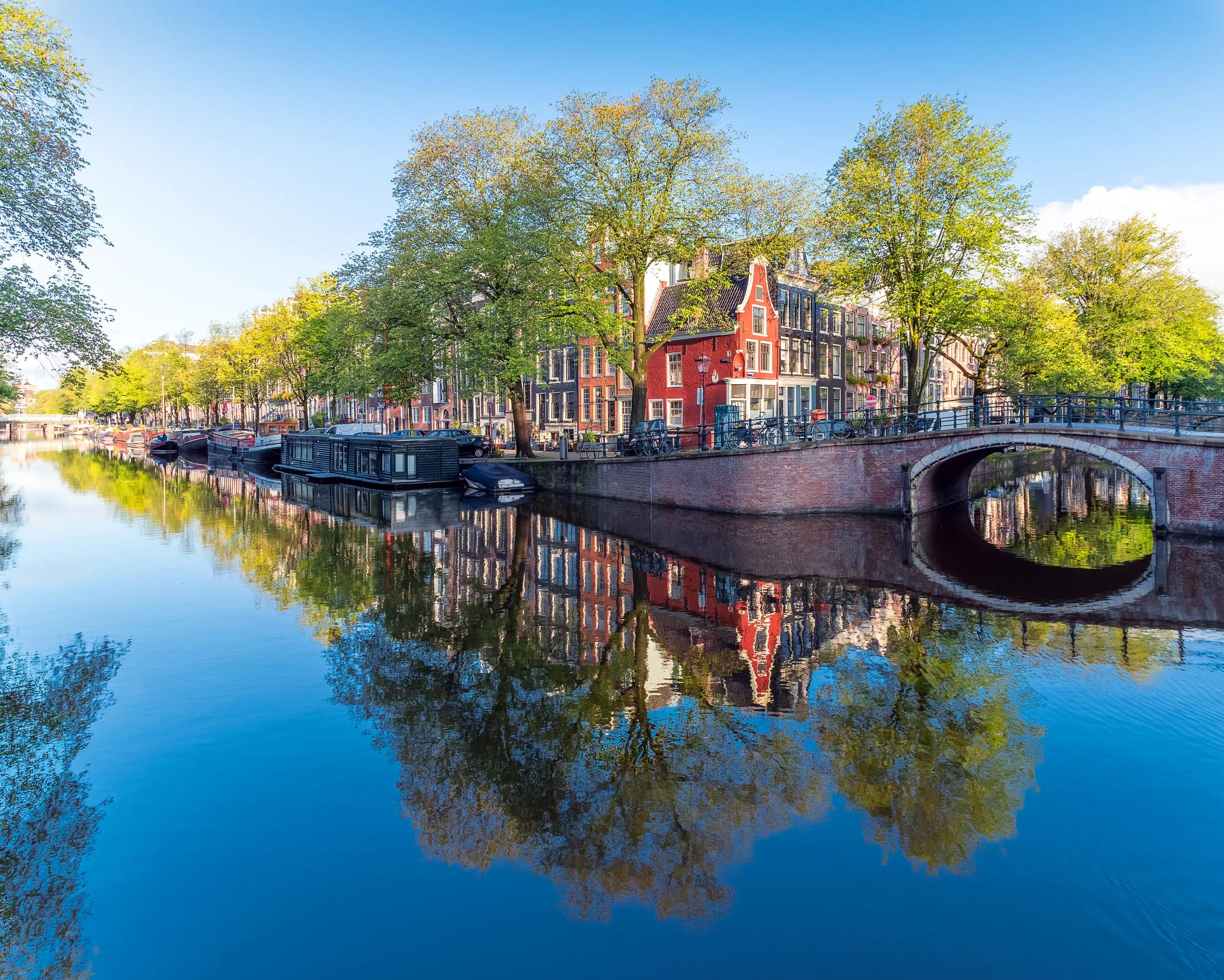 This picture was taken early in the morning in the canals of Amsterdam. With no boats yet moving on the canals and little wind the reflections are almost perfect.