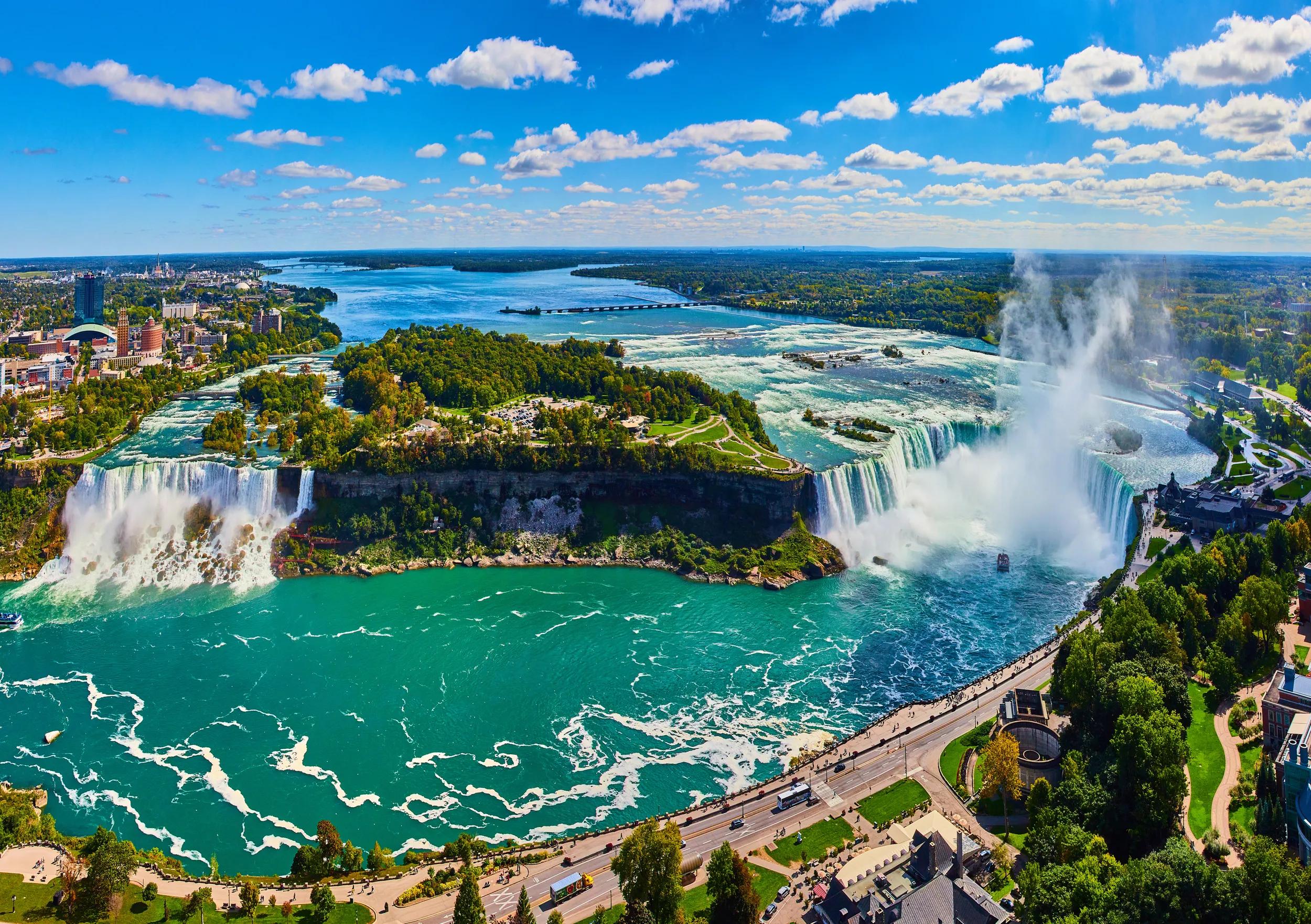 Image of Wide panorama of entire Niagara Falls from Canada overlook