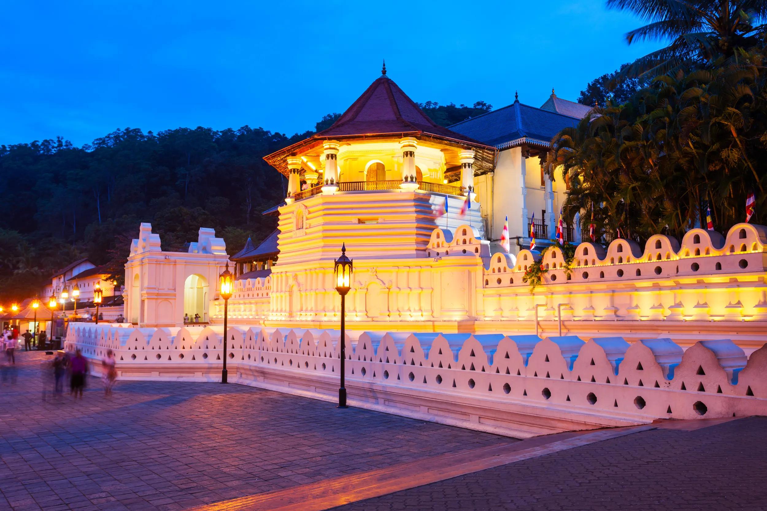 Temple of the Sacred Tooth Relic or Sri Dalada Maligawa in Kandy at sunset. Sacred Tooth Relic Temple is a Buddhist temple located in the royal palace complex of the Kingdom of Kandy.