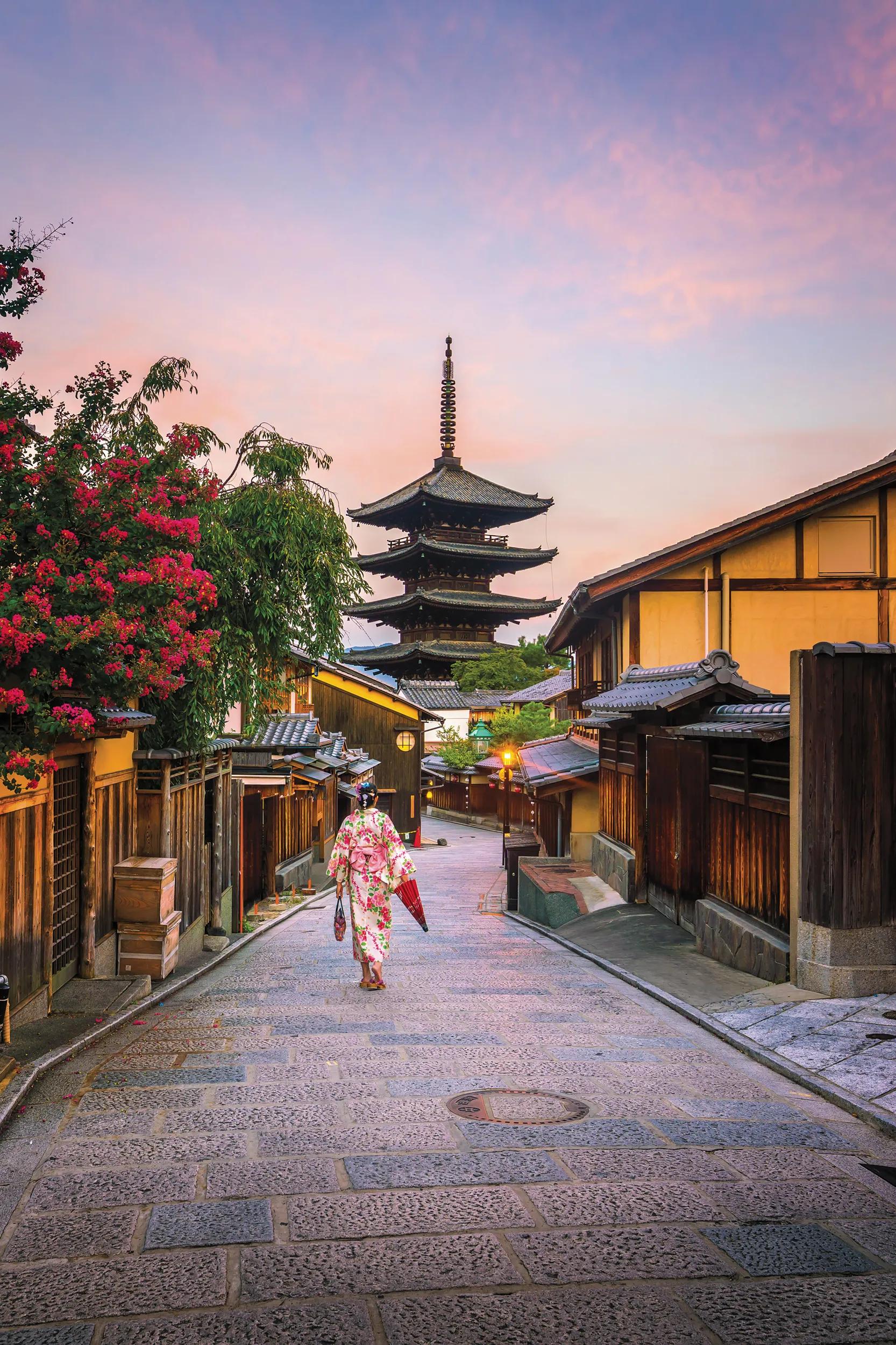Japanese girl in Yukata with red umbrella in old town  Kyoto, Japan