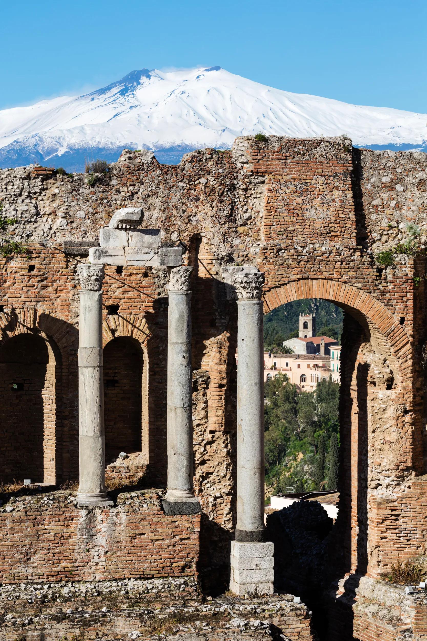 "Mount Etna over Greek Theater ruins, Taormina, Messina, Sicily"