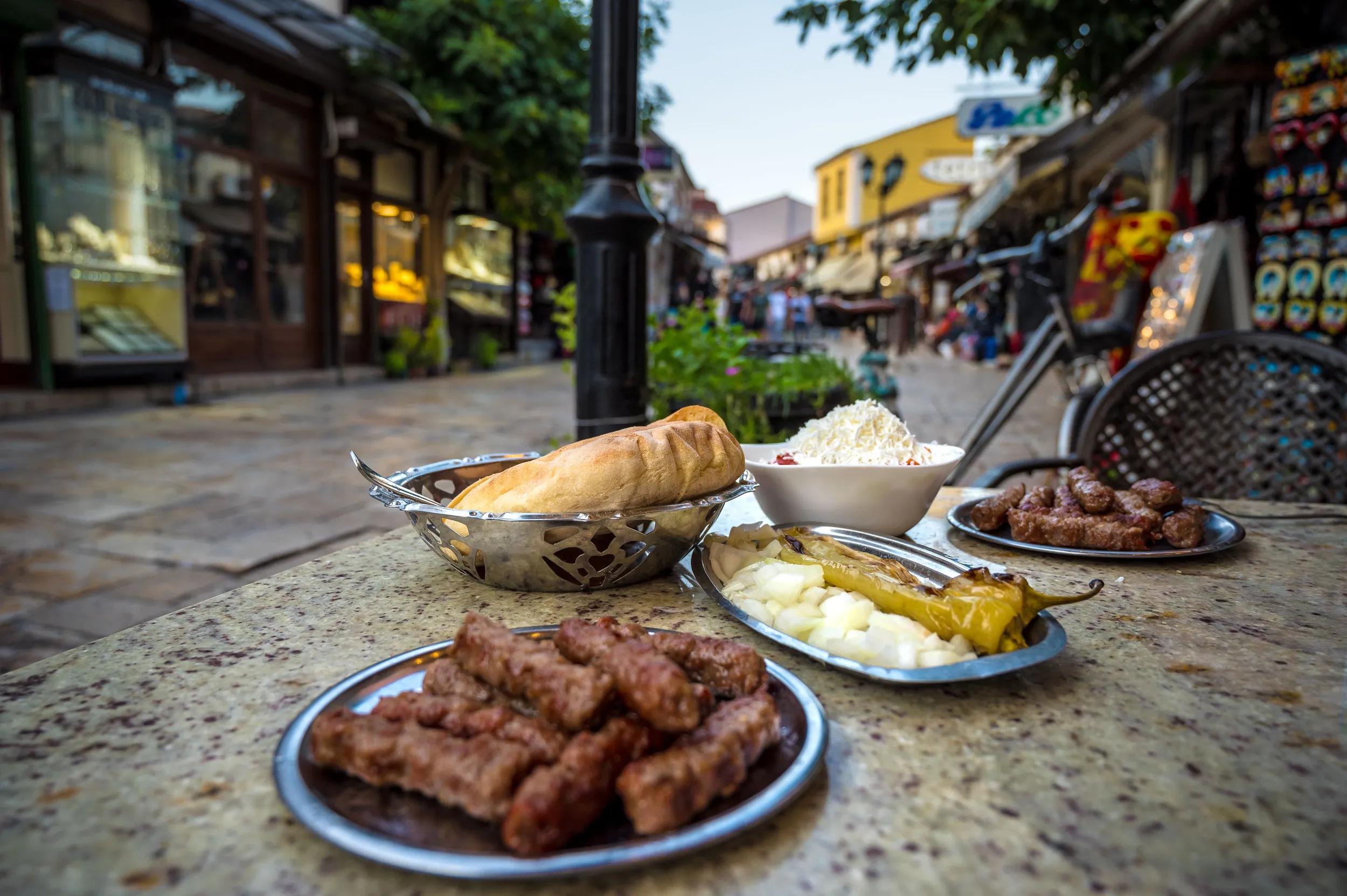 A variety of delicious traditional foods on a table in a restaurant at the Old Bazaar market in Skopje