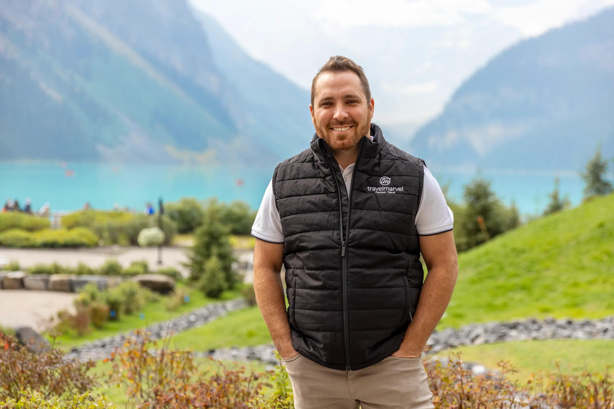 Tour Director Zac Watts in Travelmarvel uniform, Lake Louise, Canada.