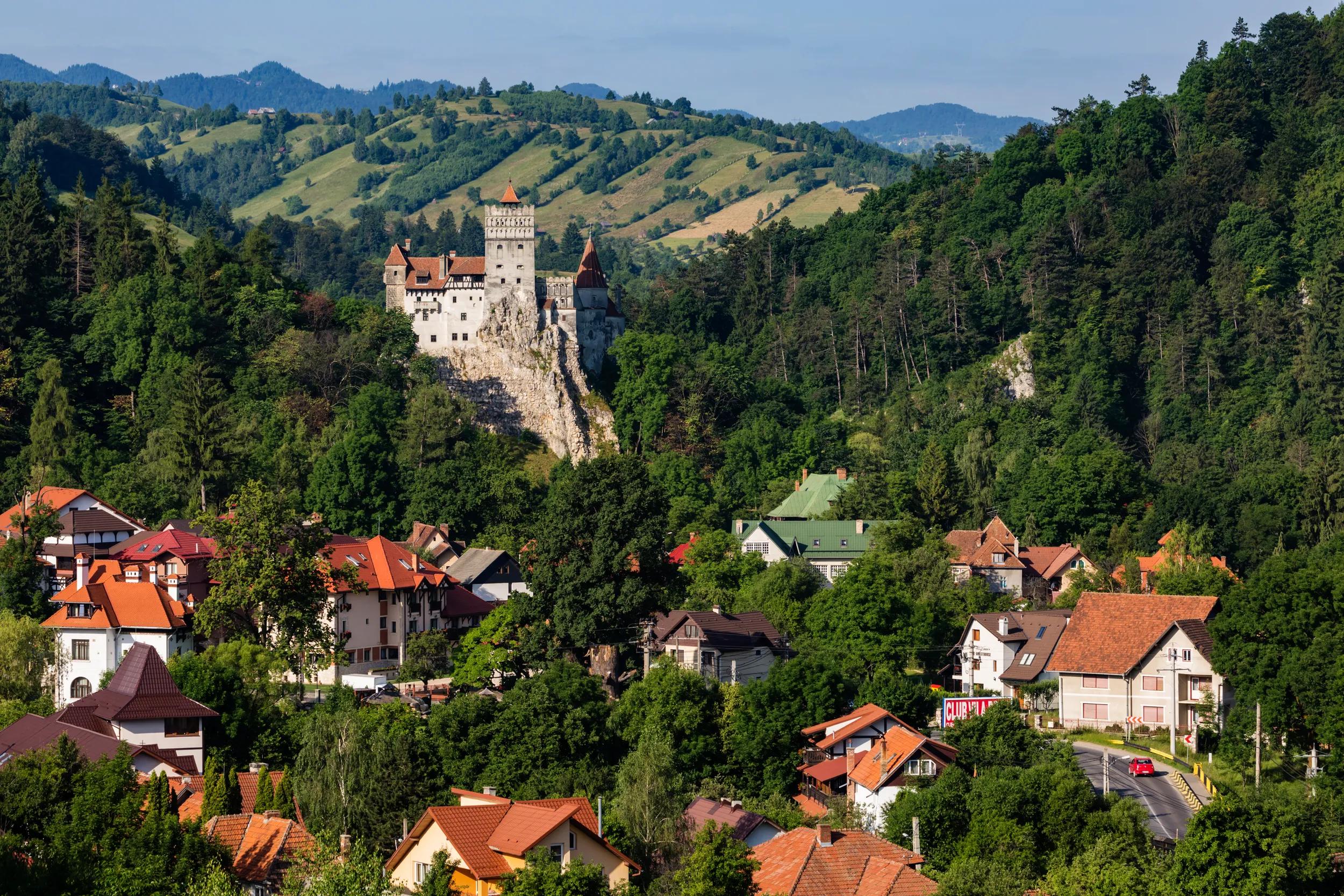 "Houses and castle in valley, Bran, Transylvania, Romania"