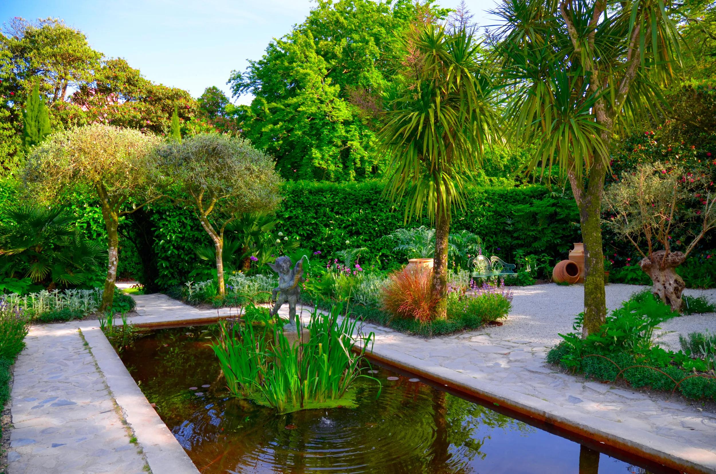 British Gardens with the Pond. Garden The British Lost Gardens of Heligan Pentewan Cornwall. Ornamental garden pond UK